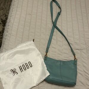 Like New HOBO - Pier Small Crossbody Pebbled Leather  in Pale Green. Dust Bag